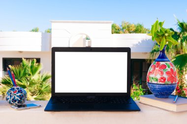 Laptop computer mock up with beautiful vases and pencils on wood