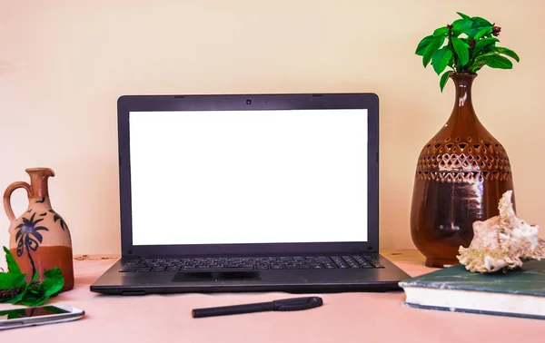 Laptop computer mock up with beautiful islamic style vases and p