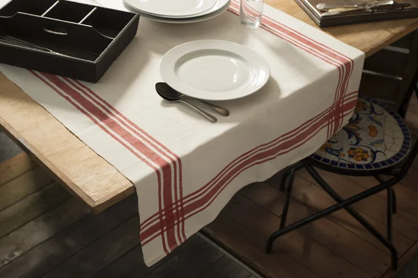 Tablecloth with Printed Red Stripes Laid on Table — Stock Photo, Image