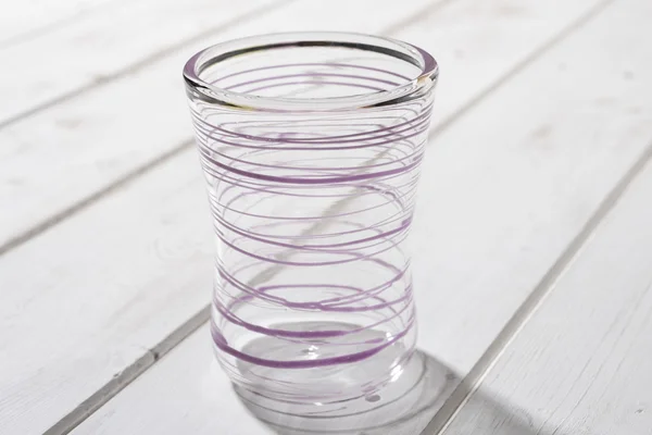 Crystal Drinking Glass with Purple Looping Streak Design — Stock Photo, Image