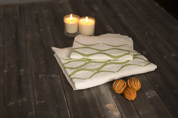 Folded Towel and Napkin with Green Concave Line Design