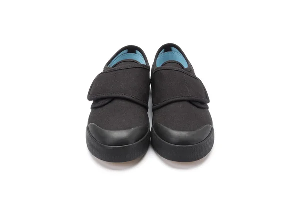 Pair of black plimsols for children — Stock Photo, Image