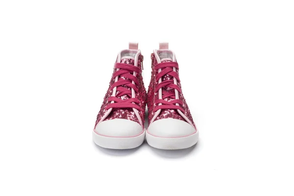 Rosa lentejuelas niños encaje bota sobre un fondo blanco —  Fotos de Stock
