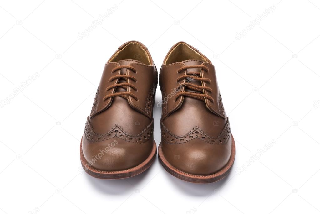 brown leather childrens lace shoe on a white background