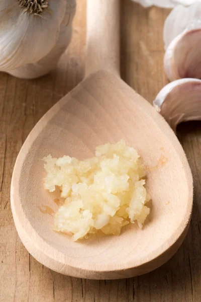 Minced Garlic on Wooden Spoon — Stock Photo, Image