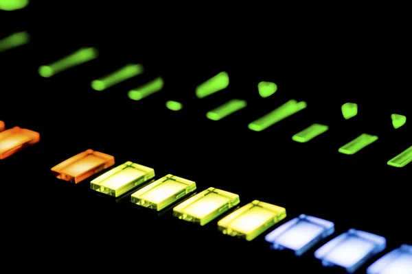 Lit buttons on a mixing panel — Stock Photo, Image