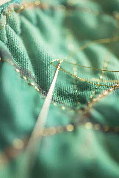 Gold-Threaded Needle Stitching Green Cloth — Φωτογραφία Αρχείου