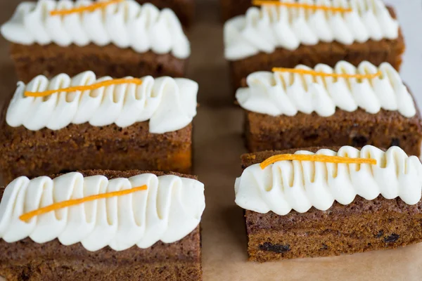 6 slices of carrot cake with cream cheese topping