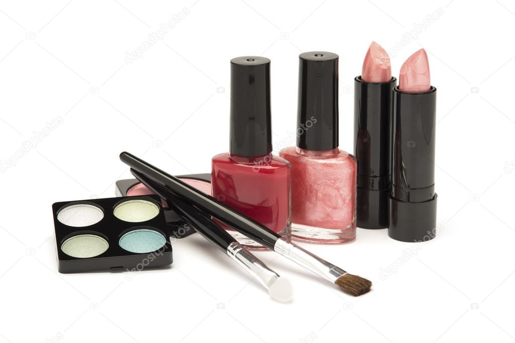 Nail polish, lipstick and blusher on a white background