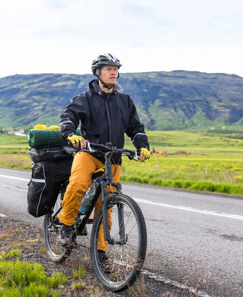 Biker on backdrop of mountains — Stok fotoğraf