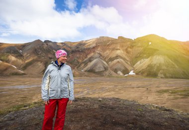 traveler on backdrop of mountains