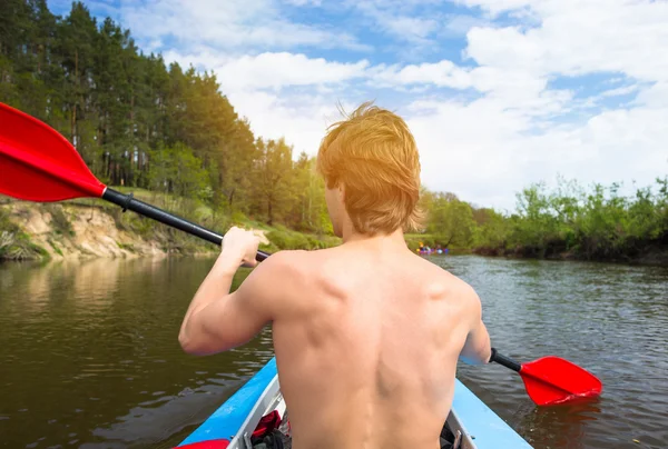 Young people are kayaking on a river in beautiful nature — Stock Photo, Image