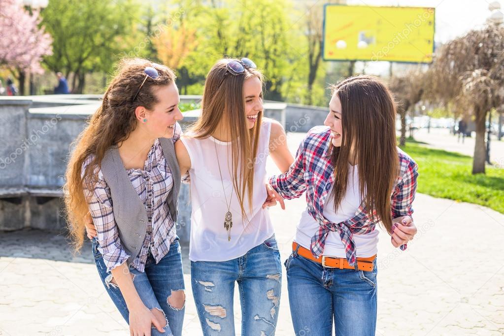 Teen girls enjoy friendship. Young happy teenagers having fun in summer ...