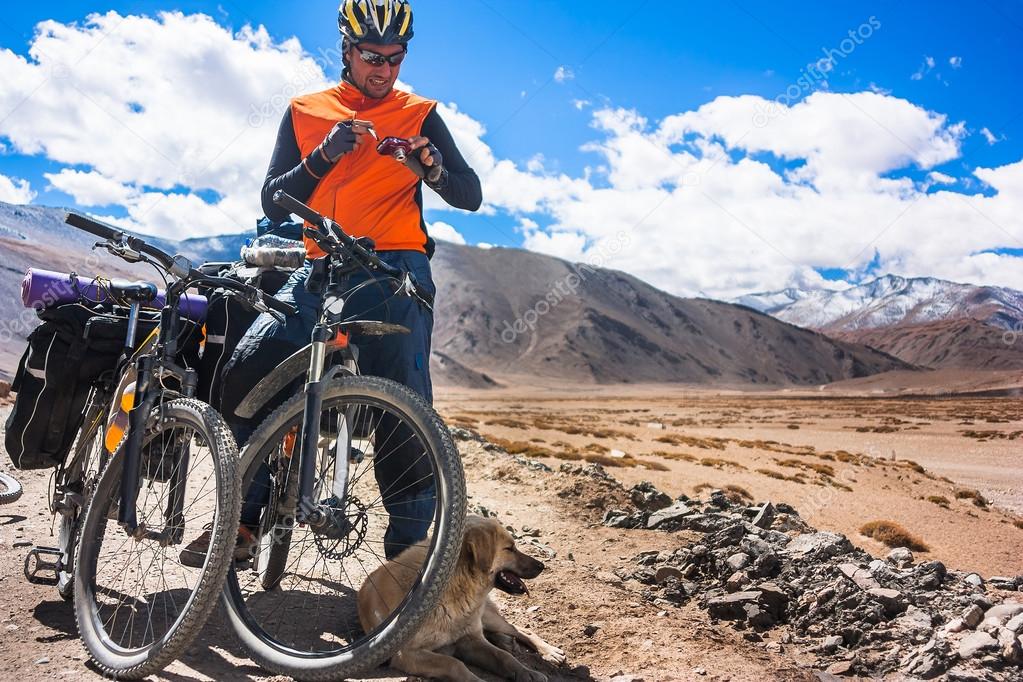 Young bikers rides on mountain roud in Himalayas, India