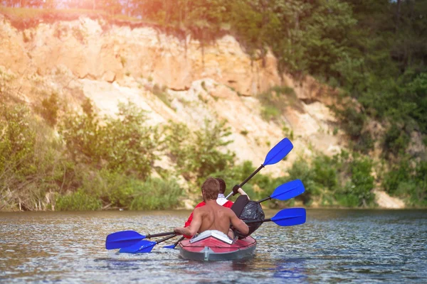 Young people are kayaking on a river in beautiful nature — Stock Photo, Image