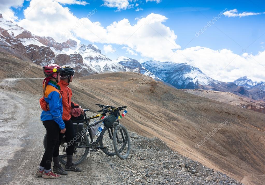 Bicyclist riding in fantastic landscape on mountain road, Jammu and Kashmir State, North India