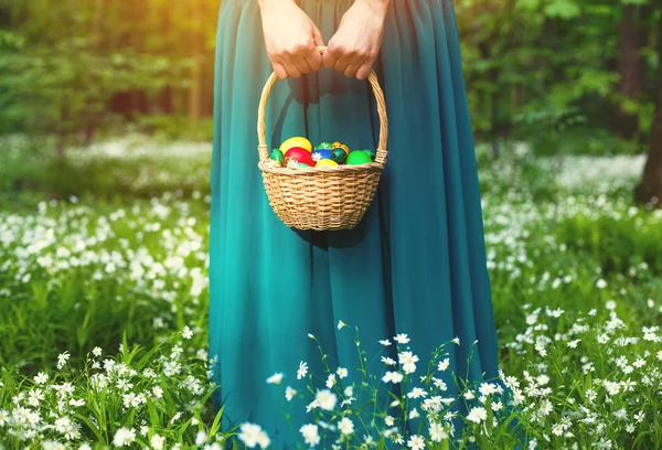 Girl holding Basket of easter eggs — Stock Photo, Image