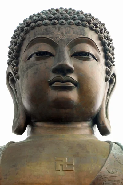 Enorme hoofd van een Boeddha op een witte achtergrond Stockfoto