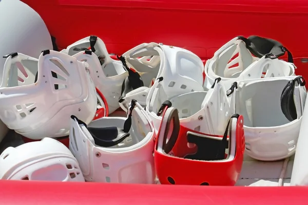 Red helmet among whites — Stock Photo, Image