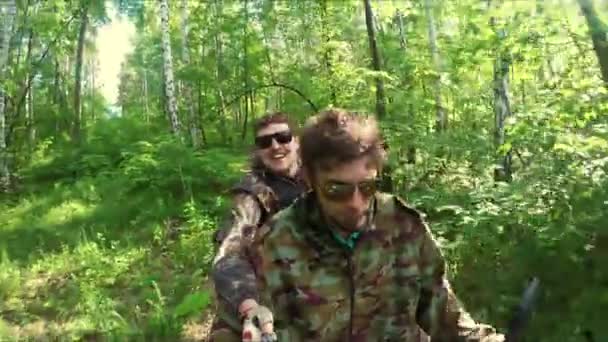 Two guys on quad ride through the forest — Stock Video