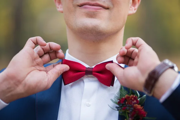 Red bow tie with white shirt