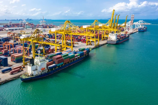 shipping port loading unloading containers and shipping cargo containers businesses services import and export international open sea aerial view from drone