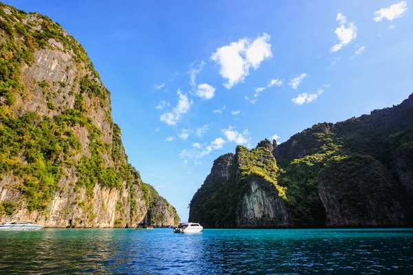 landscape the sea and mountain blue sky background with speed boat tourists and long tail boat rental high season summer holiday on maya phi phi island kra bi Thailand