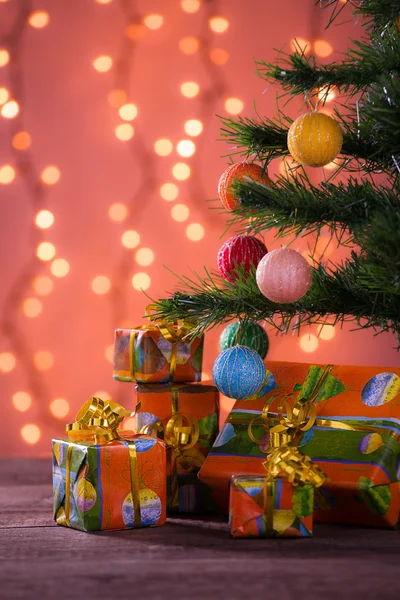 Christmas gifts with blurred lights — Stock Photo, Image