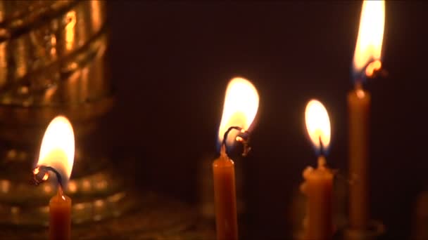 Burning candles in church — Stock Video