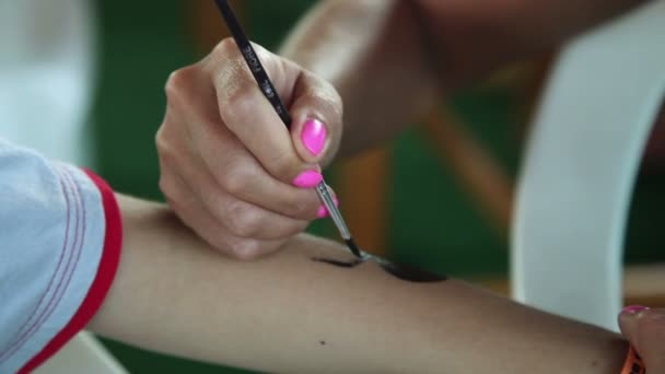 Woman Paints A Spider On The Hand — Stock Video