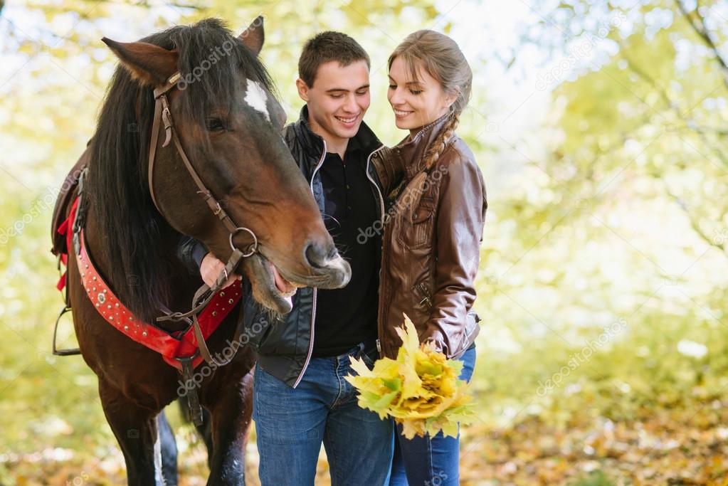 couple in love, horseback riding, tenderness, forest, fun