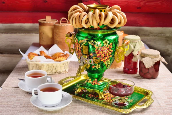 Russian character - a samovar. A bunch of bagels. Homemade jam. — Stock Photo, Image