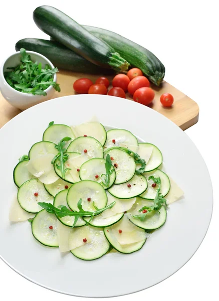 Salad of zucchini with cheese and arugula on isolated background — Stock Photo, Image