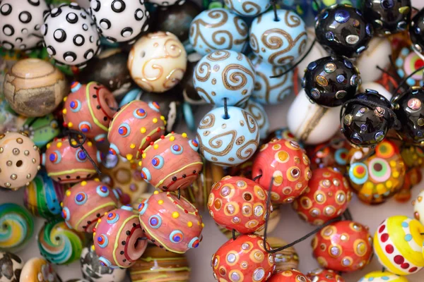 A pile of glass beads of different colors, lampwork — Stock Photo, Image