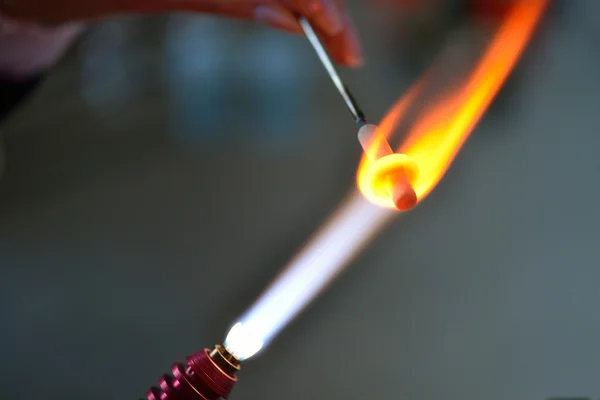 Gas burner glows glass decoration, lampwork — Stock Photo, Image