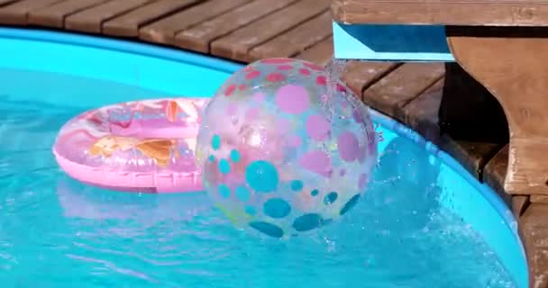 Children Buoy and Inflatable Ball at Swimming Pool — Stock Video