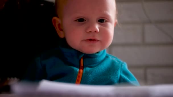 Video baby feeding baby with a spoon porridge — Stock Video