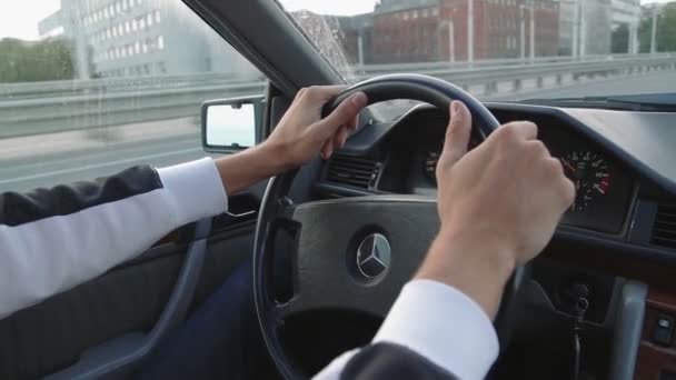 KALININGRAD, RUSSIA - AUGUST 13, 2016: Hands of a man driving a car in slow motion — Stock Video