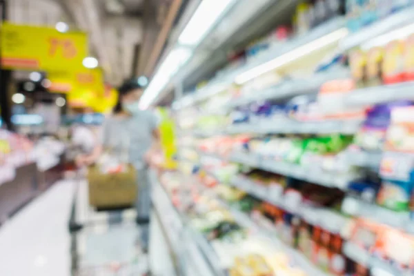 Abstract Defocused Blurred of Consumer Goods and Shopping Cart in Supermarket Store, Shop Trolley Basket in Department Store. Business Retail and Customer Shopping Mall Service, Convenience Concept.