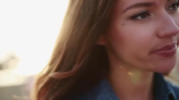 Beautiful girl close-up on sunset — Stock Video