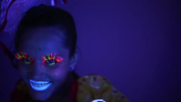 Close-up of a girl with neon face — Stock Video