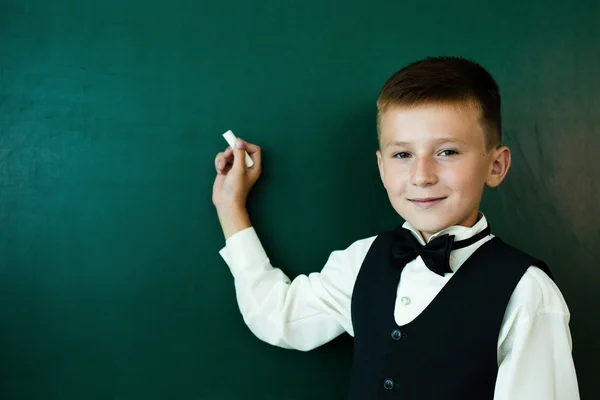 Pupil on classroom board — Stock Photo, Image