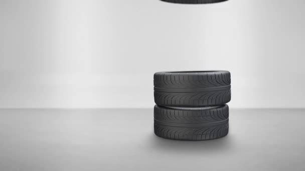 Stohovací pneumatiky a jedno boční kolo na bílém pozadí — Stock video