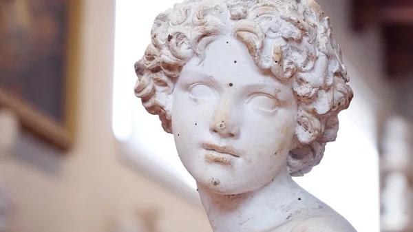 Child face sculpture from museum in Florence — Stockfoto