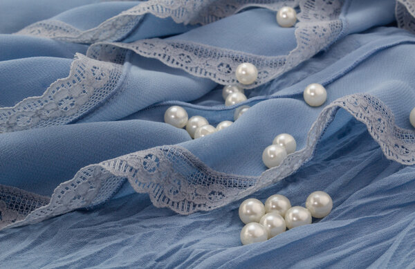 Pearls on blue chiffon and lace