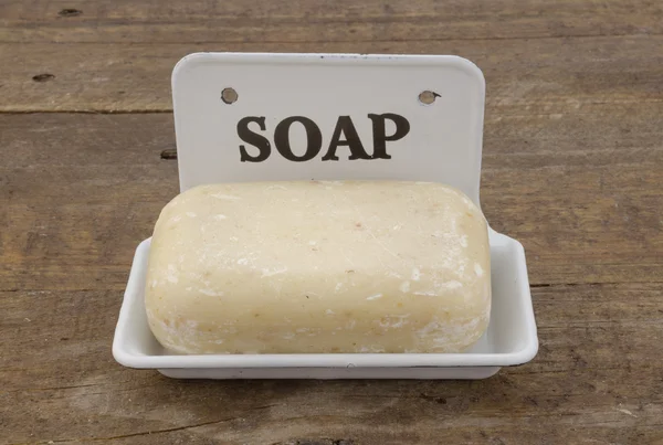 Bar of soap in vintage soap dish — Stock Photo, Image