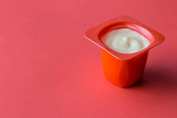 Yogurt Cup Red Background Delicious Fruit Yoghurt Red Plastic Pot — Stock Photo, Image