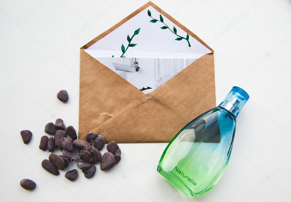 Brown envelope, perfume smell of freshness and small pebbles purple.