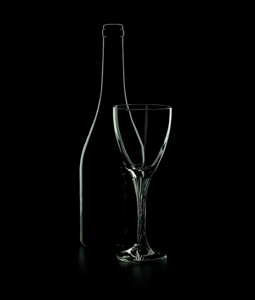 Bottle of red wine with glass on a black background — Stock Photo, Image