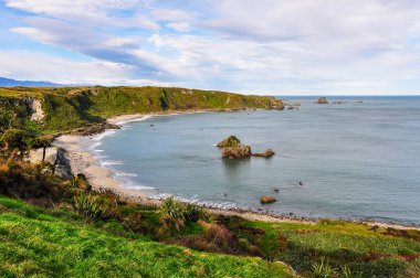 Sandy beach Cape Foulwind, Yeni Zelanda